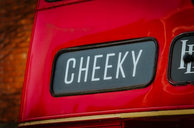 Cheekily — нахально